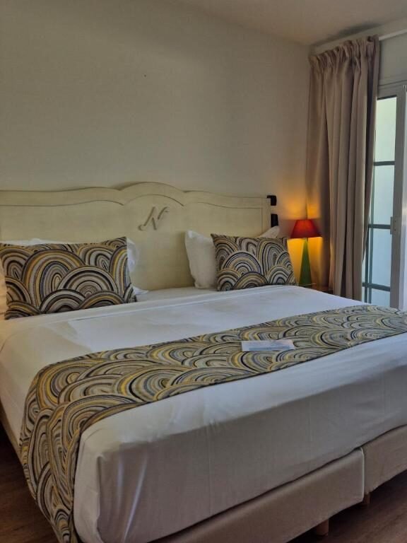 Double Room at Hotel Le Nautile: Comfort and Poolside Views
